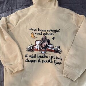 Cream Graphic Hoodie with Western Design